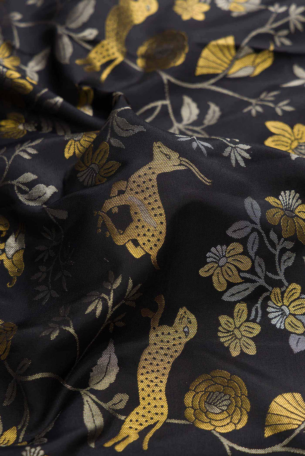 Close up of Black Dual Tone Kanchipuram Silk Saree with Zari Brocade on the body and Zari Border displaying folds