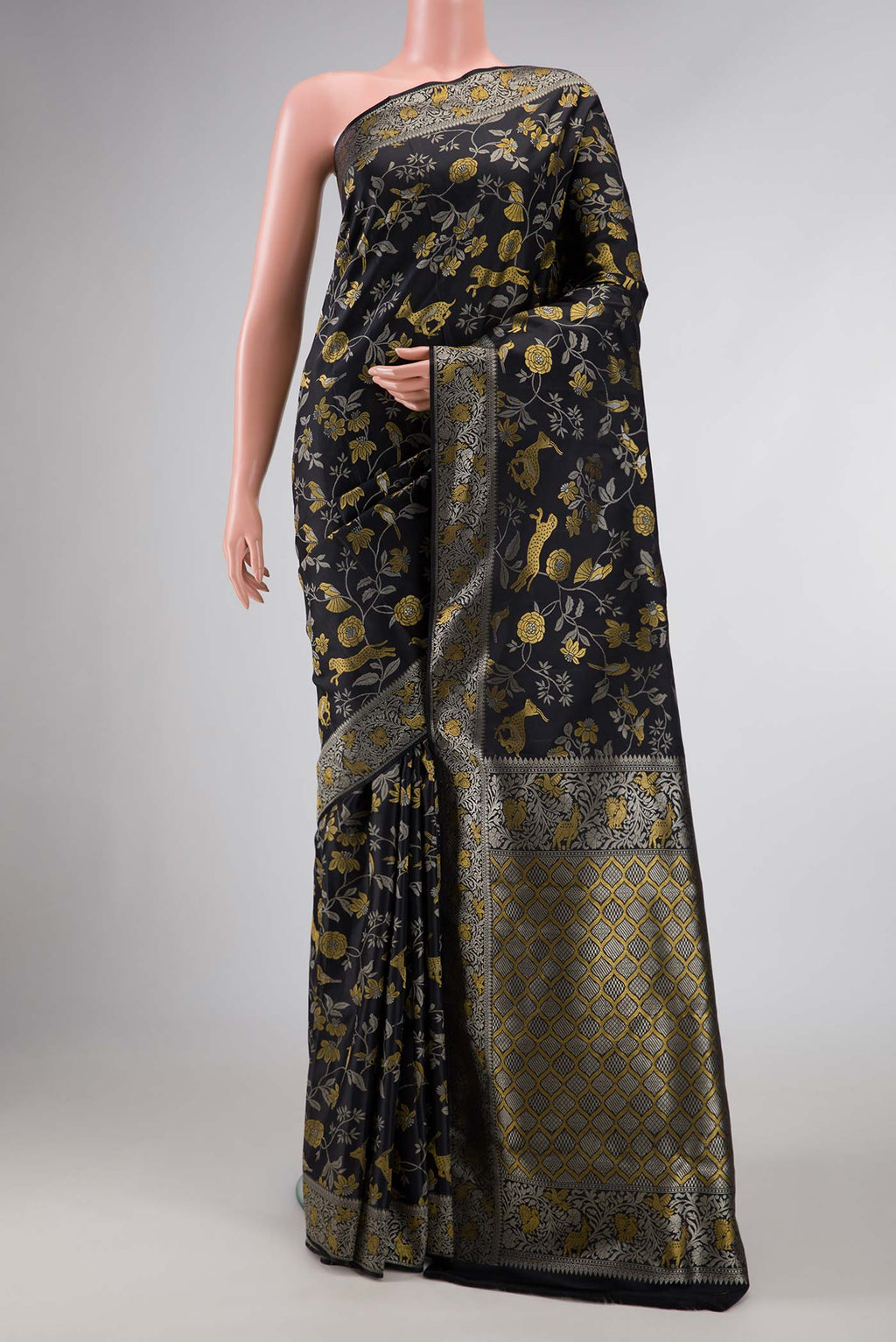 Black Dual Tone Kanchipuram Silk Saree with Zari Brocade on the body and Zari Border displayed on a mannequin