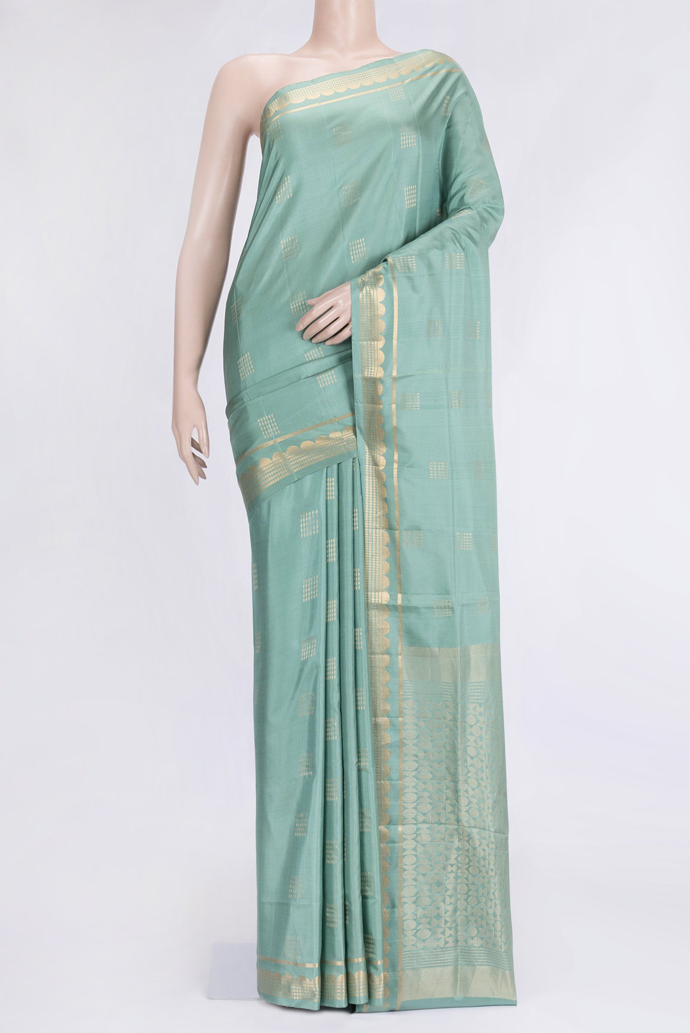Sea Green Dual Tone Soft Silk Saree with Zari Butta on the body and Zari Border.  displayed on a mannequin