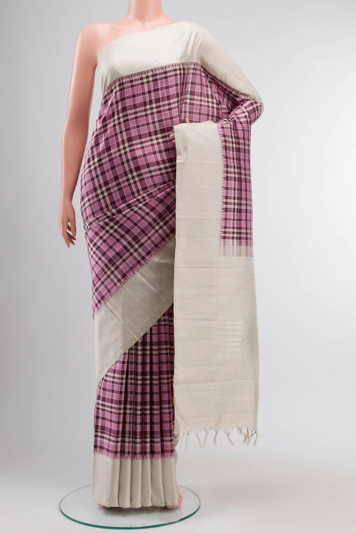 Multi Color Kanchipuram Silk Saree with Checked design on the body and Plain Border displayed on a mannequin