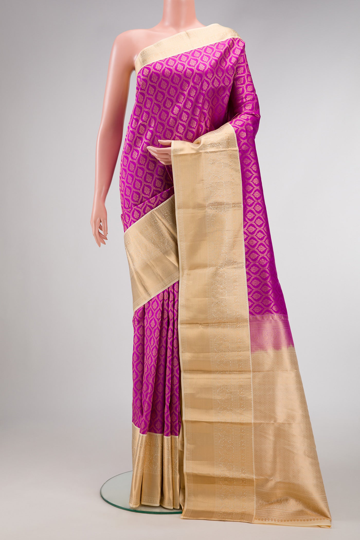 Magenta Dual Tone Kanchipuram Silk Saree with Zari Brocade on the body and Zari Border.  displayed on a mannequin