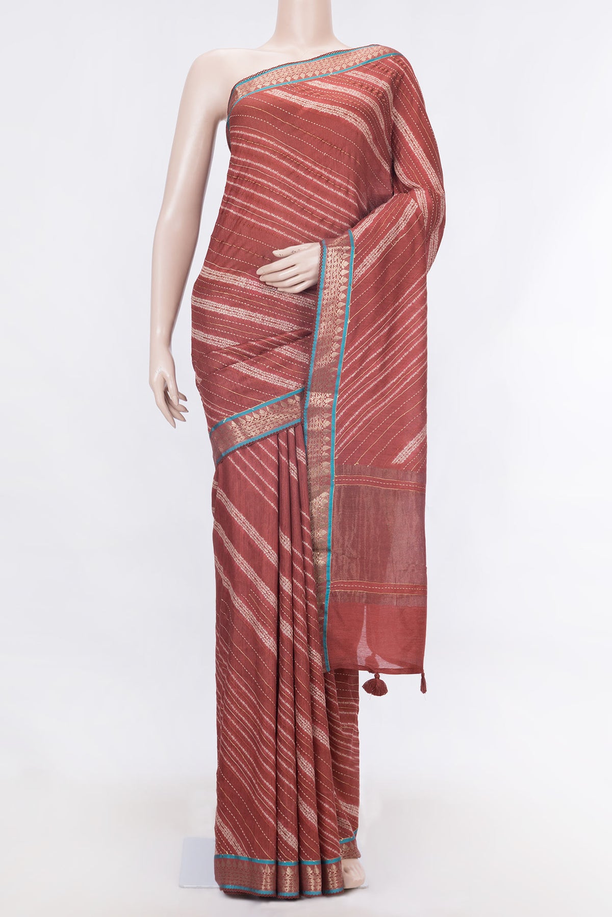 Orange Dual Tone Tussar Silk Saree With Printed design on the body and Zari Border displayed on a mannequin