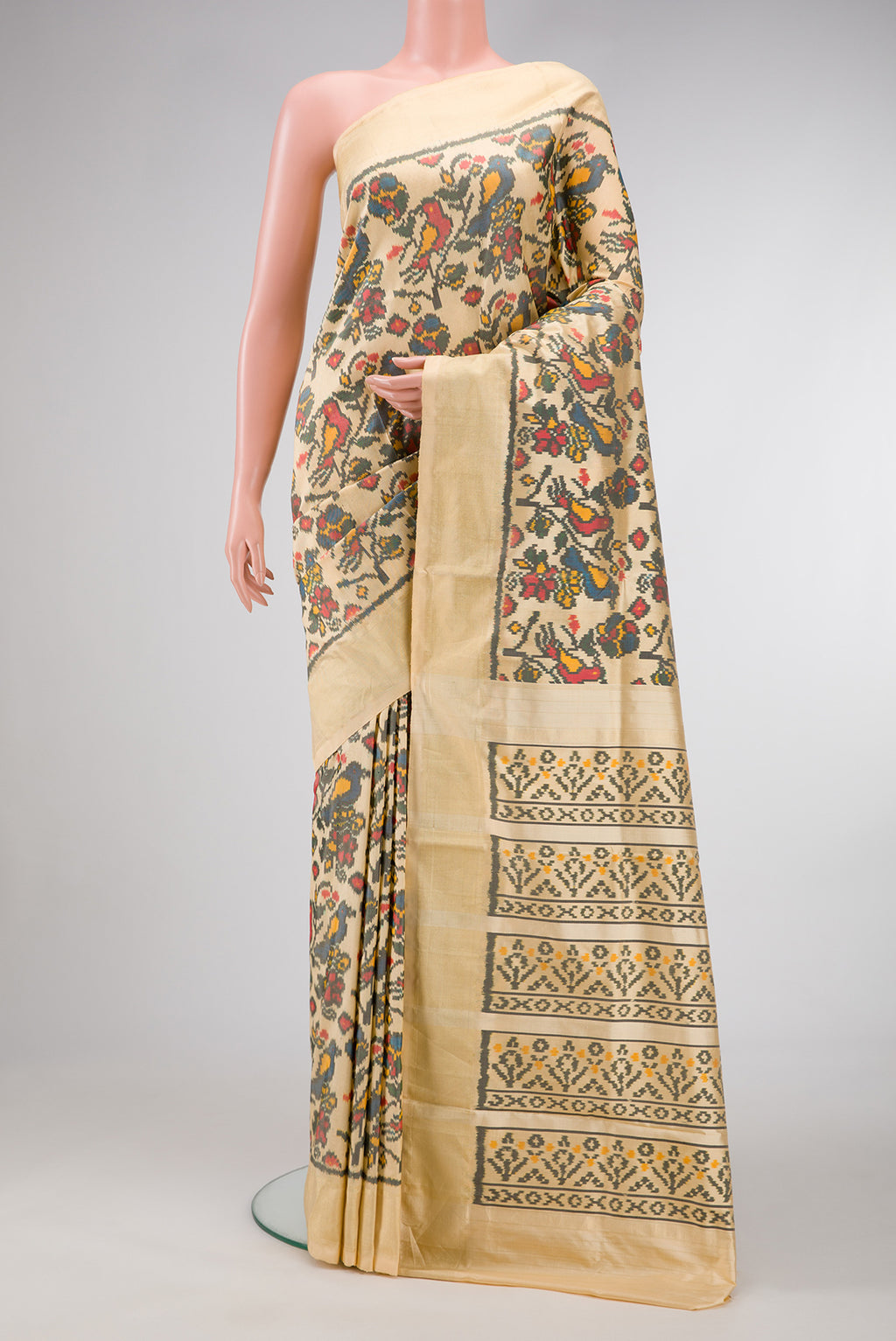 Sandal Dual Tone Double Ikat Saree with Ikat Print on the body and Zari Border.  displayed on a mannequin