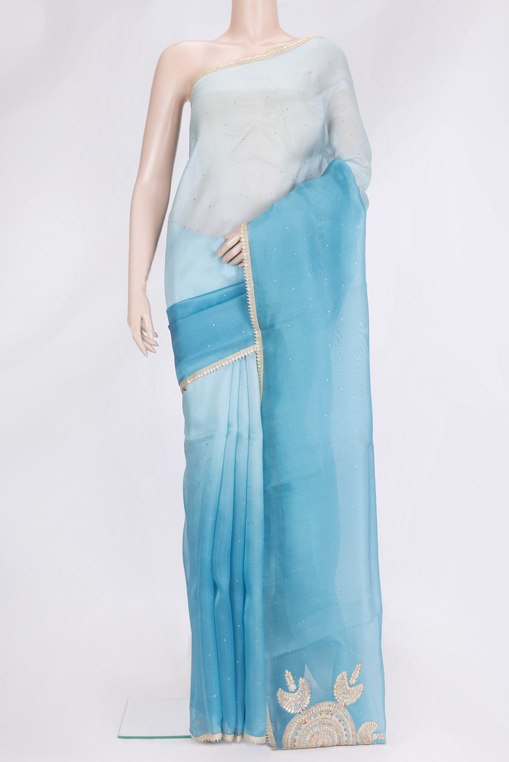 Sky Blue Dual Tone Organza Silk Saree with Embroidery on the body and Embroidery Border.  displayed on a mannequin