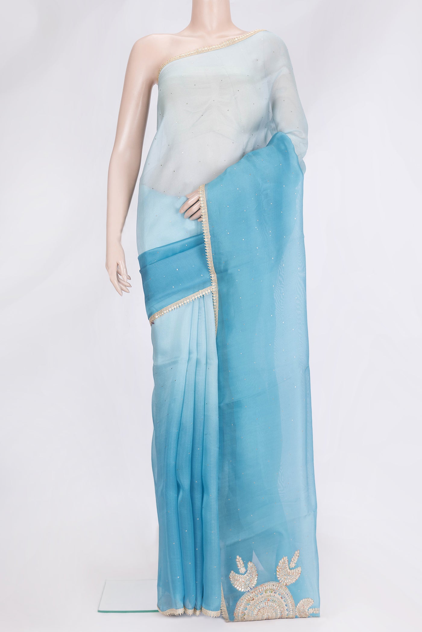 Sky Blue Dual Tone Organza Silk Saree with Embroidery on the body and Embroidery Border.  displayed on a mannequin