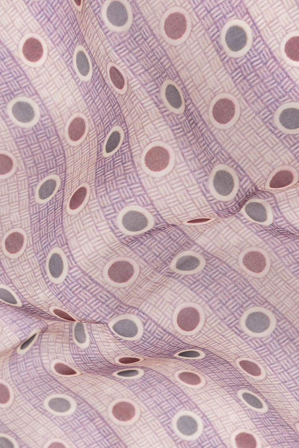 Close up of Purple and Beige Color Organza Silk Saree with Printed design on the body and Printed Border.  displaying folds