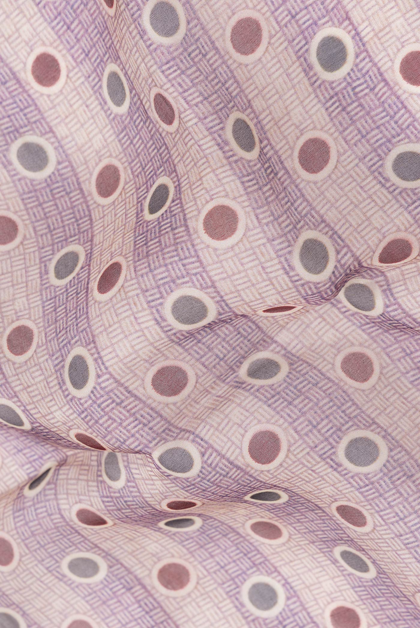 Close up of Purple and Beige Color Organza Silk Saree with Printed design on the body and Printed Border.  displaying folds
