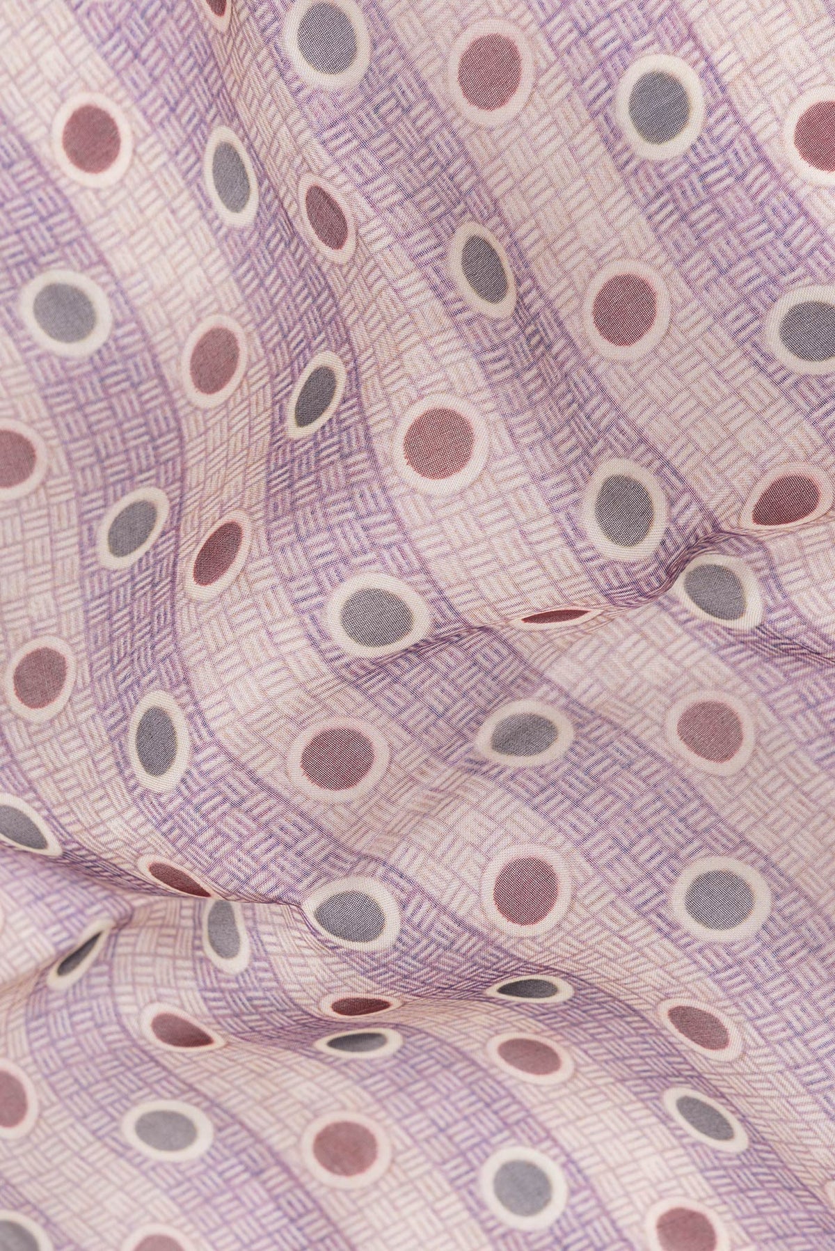 Close up of Purple and Beige Color Organza Silk Saree with Printed design on the body and Printed Border.  displaying folds