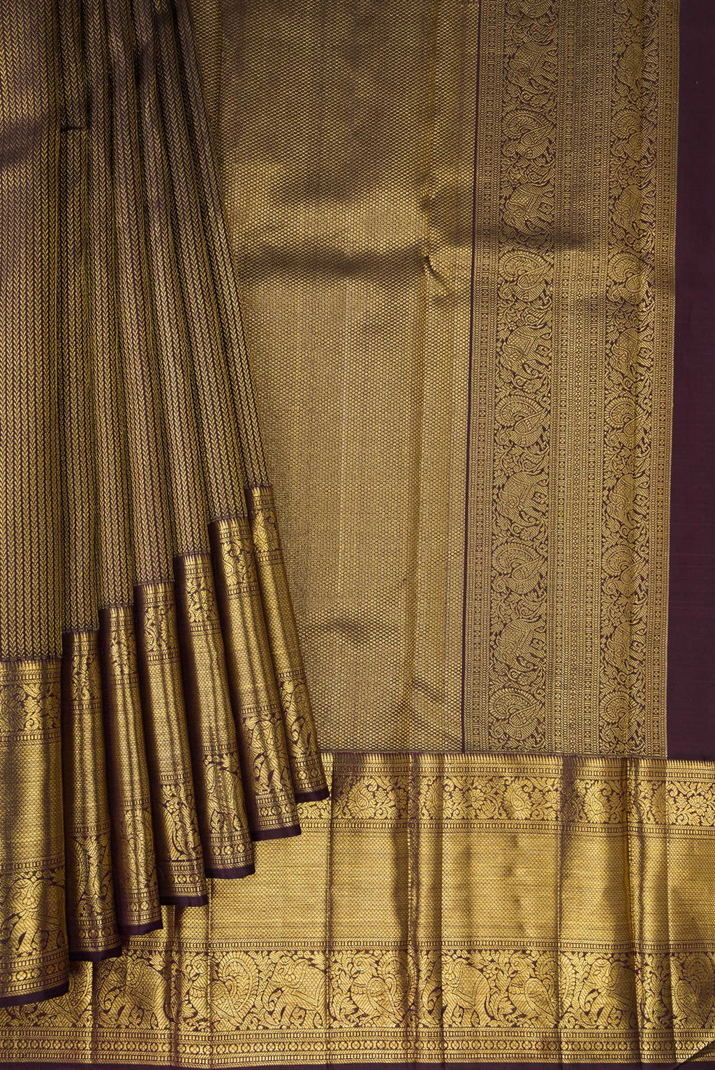 Pleats and pallu of Coffee Brown Dual Tone Kanchipuram Silk Saree with Zari Brocade on the body and Zari Border. 