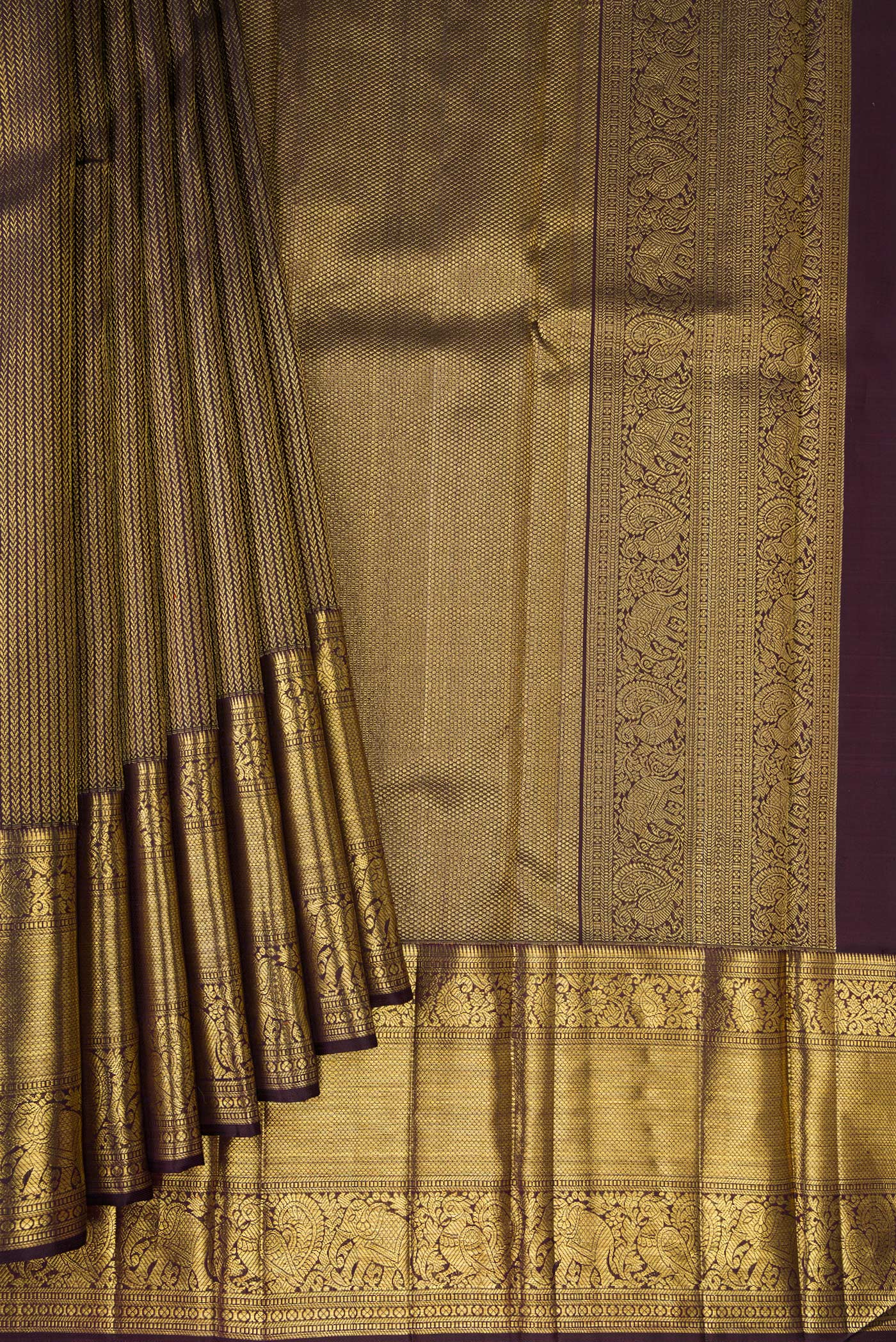 Pleats and pallu of Coffee Brown Dual Tone Kanchipuram Silk Saree with Zari Brocade on the body and Zari Border. 