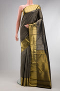Black Kanchipuram Silk Saree with Zari Brocade on the body and Zari Border.  displayed on a mannequin