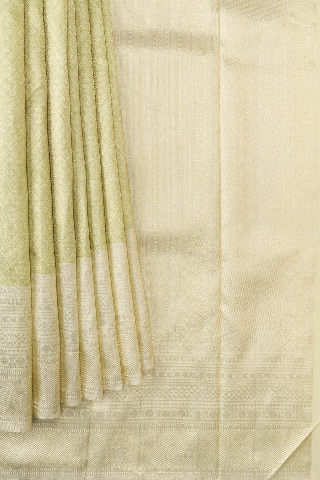 Pleats and pallu of Pista Green Dual Tone Kanchipuram Silk Saree with Zari Brocade on the body and Zari Border. 