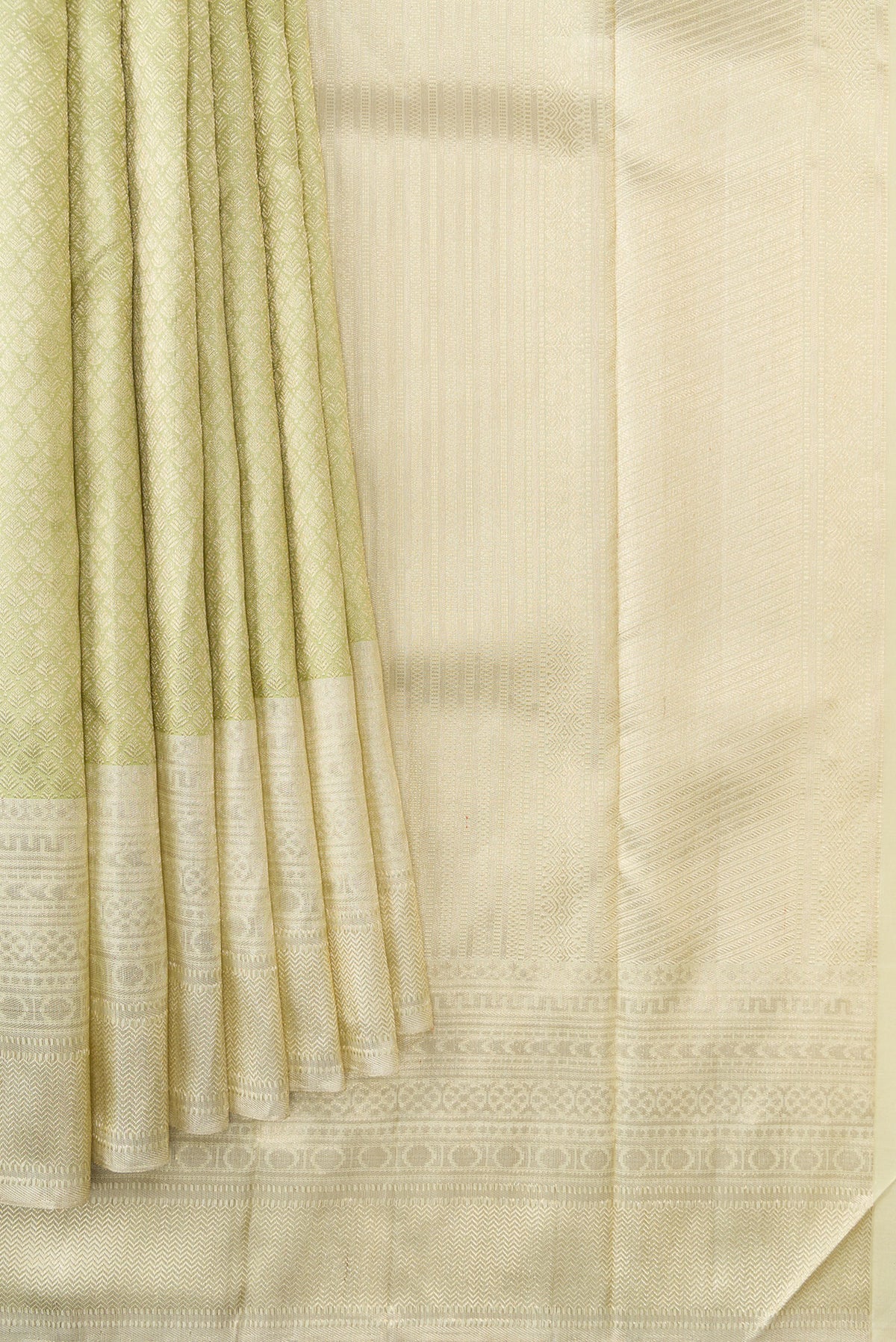Pleats and pallu of Pista Green Dual Tone Kanchipuram Silk Saree with Zari Brocade on the body and Zari Border. 