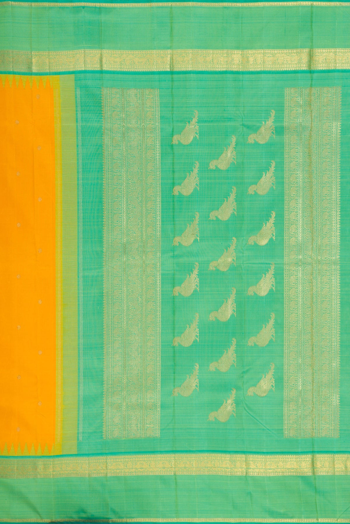 Close up image of the pallu of Yellow Kanchipuram Silk Saree with Zari Butta on the body and Zari Border. 