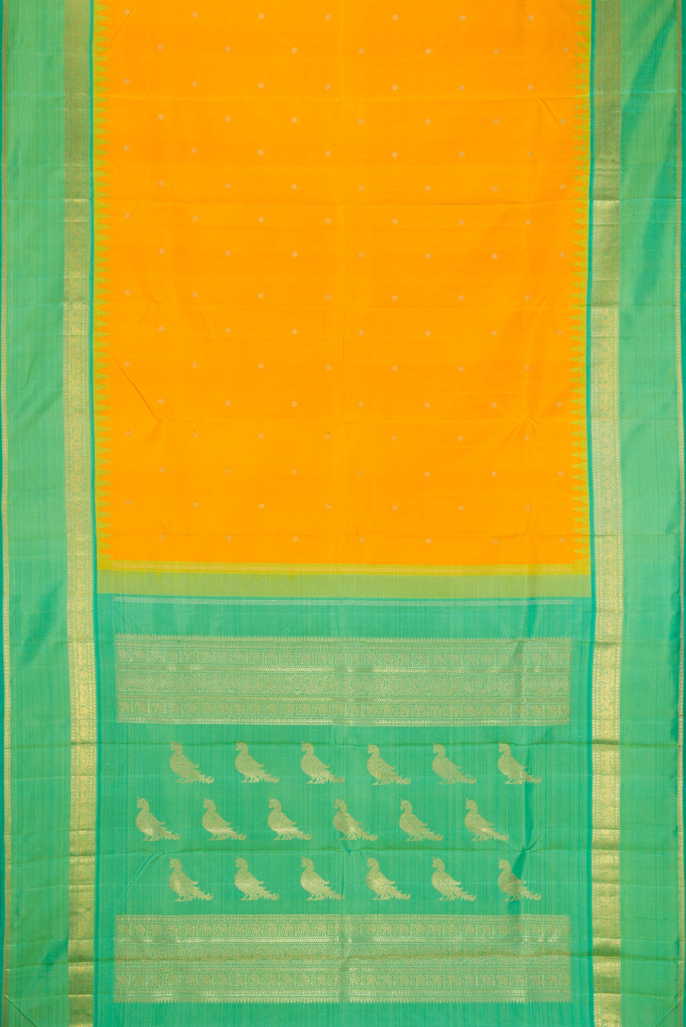Flat view of Yellow Kanchipuram Silk Saree with Zari Butta on the body and Zari Border. 