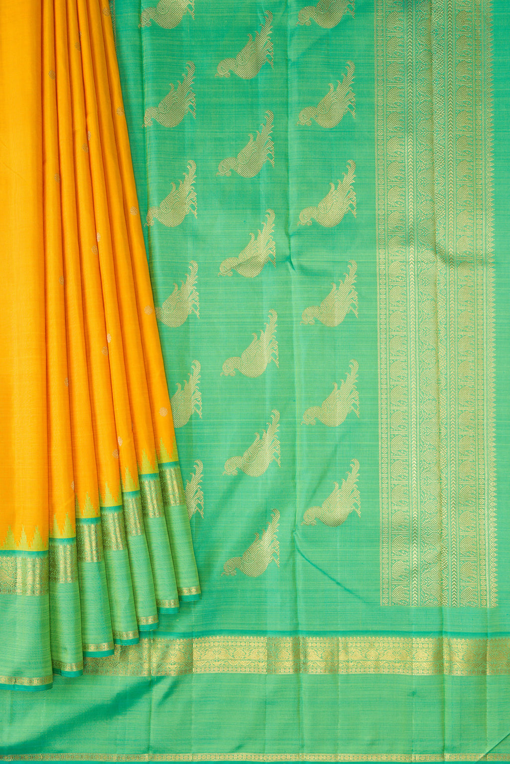 Pleats and pallu of Yellow Kanchipuram Silk Saree with Zari Butta on the body and Zari Border. 