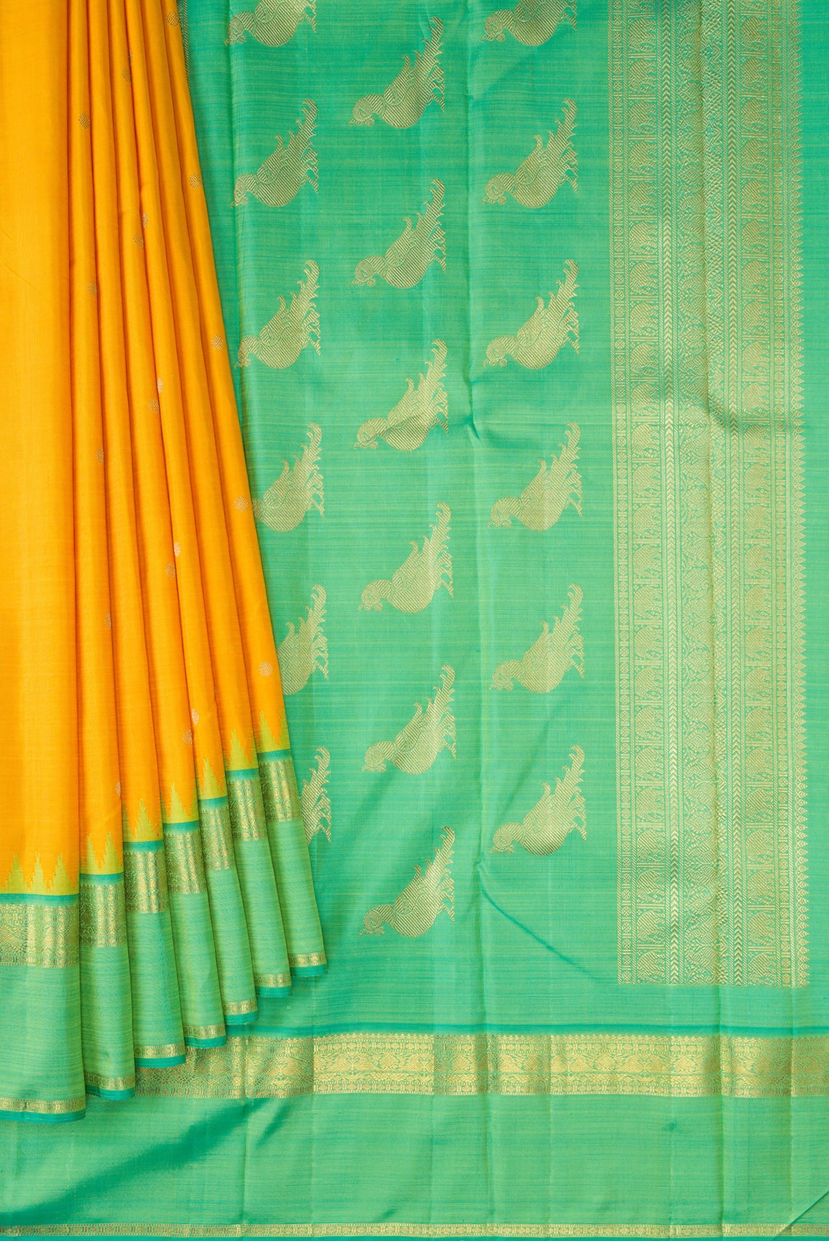 Pleats and pallu of Yellow Kanchipuram Silk Saree with Zari Butta on the body and Zari Border. 