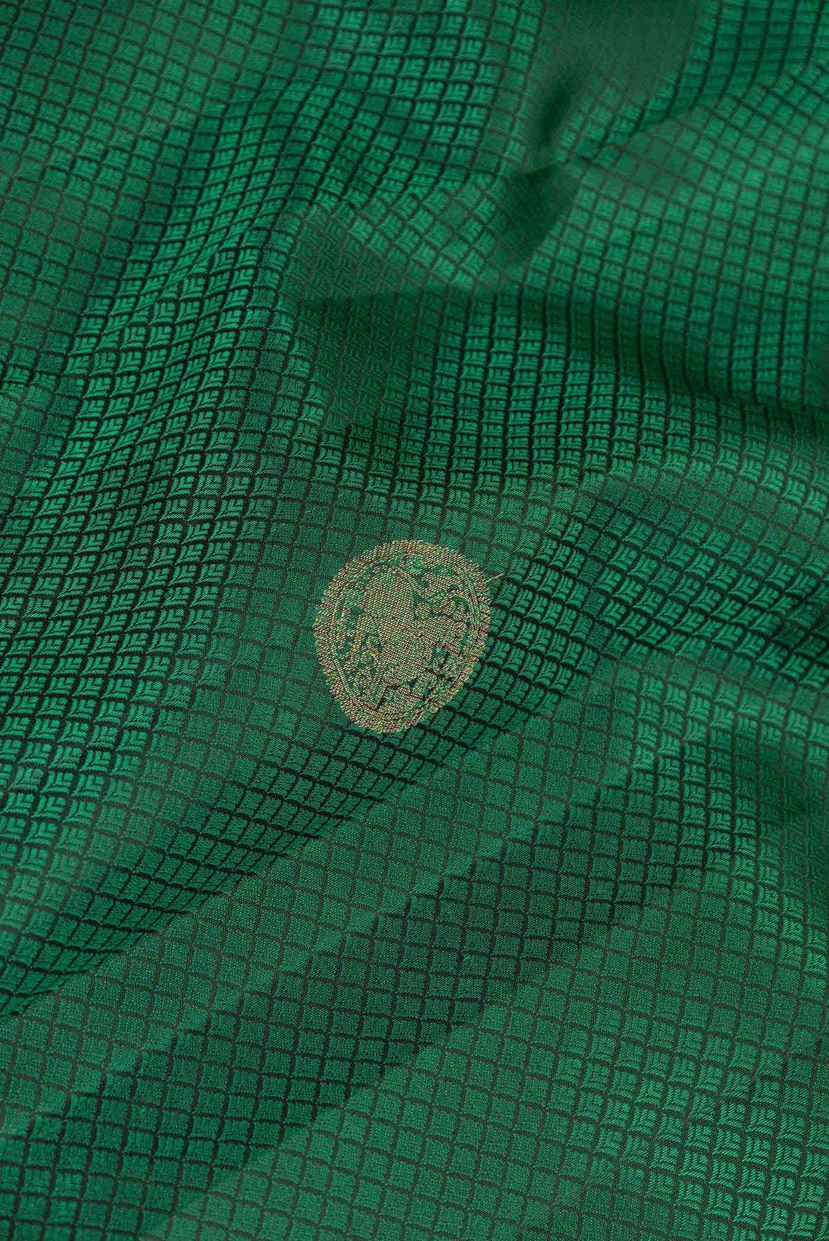 Close up of Pure Silk Pure Zari Green Dual Tone Kanchipuram Saree with Jacquard With Zari Butta on the body and Zari Border displaying folds