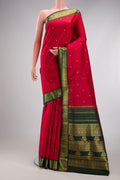 Pure Silk Pure Zari Red Kanchipuram Saree with Zari Butta on the body and Zari Border.  displayed on a mannequin