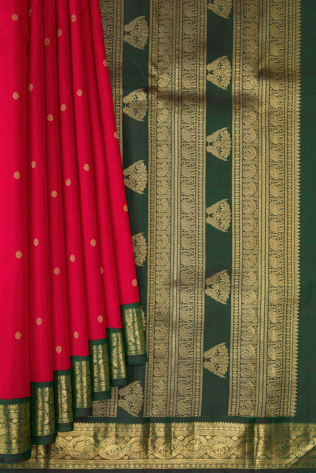 Pleats and pallu of Pure Silk Pure Zari Red Kanchipuram Saree with Zari Butta on the body and Zari Border. 