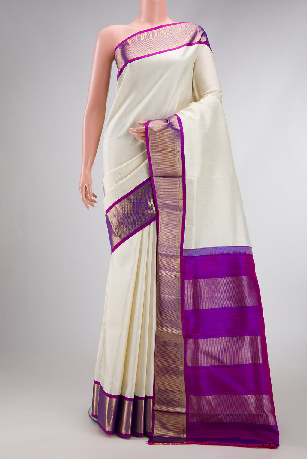 Pure Silk Pure Zari Off White Dual Tone Kanchipuram Nine Yards Saree with Zari Brocade on the body and Zari Border.  displayed on a mannequin