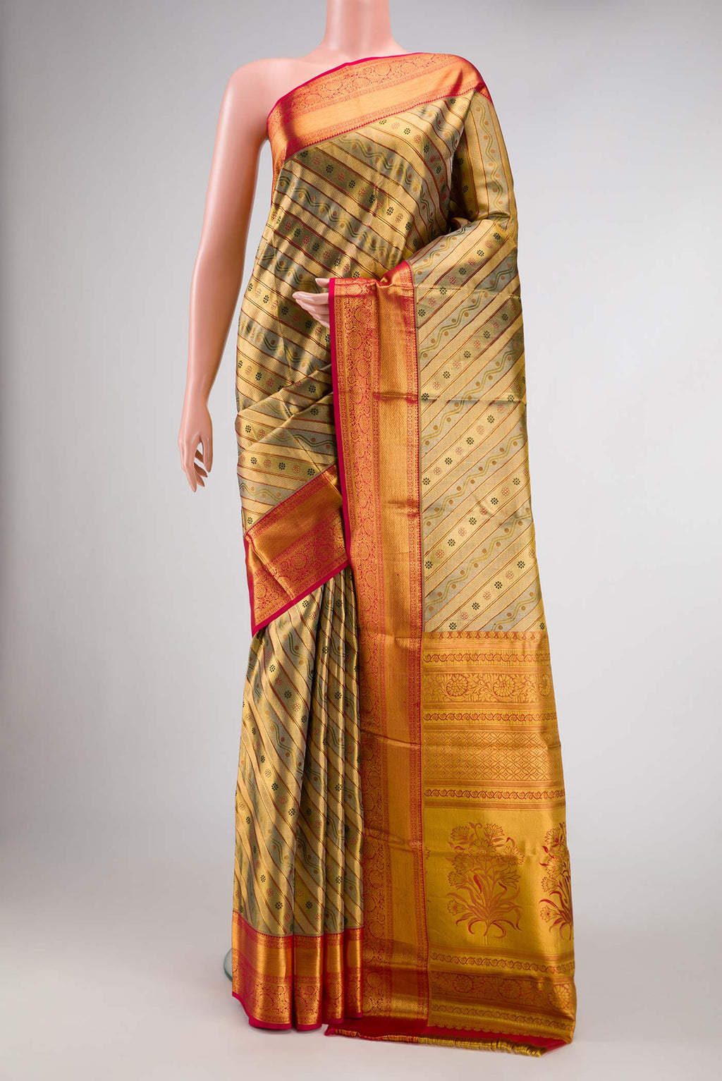 Gold Dual Tone Kanchipuram Tissue Silk Saree with Zari Brocade on the body and Zari Border.  displayed on a mannequin