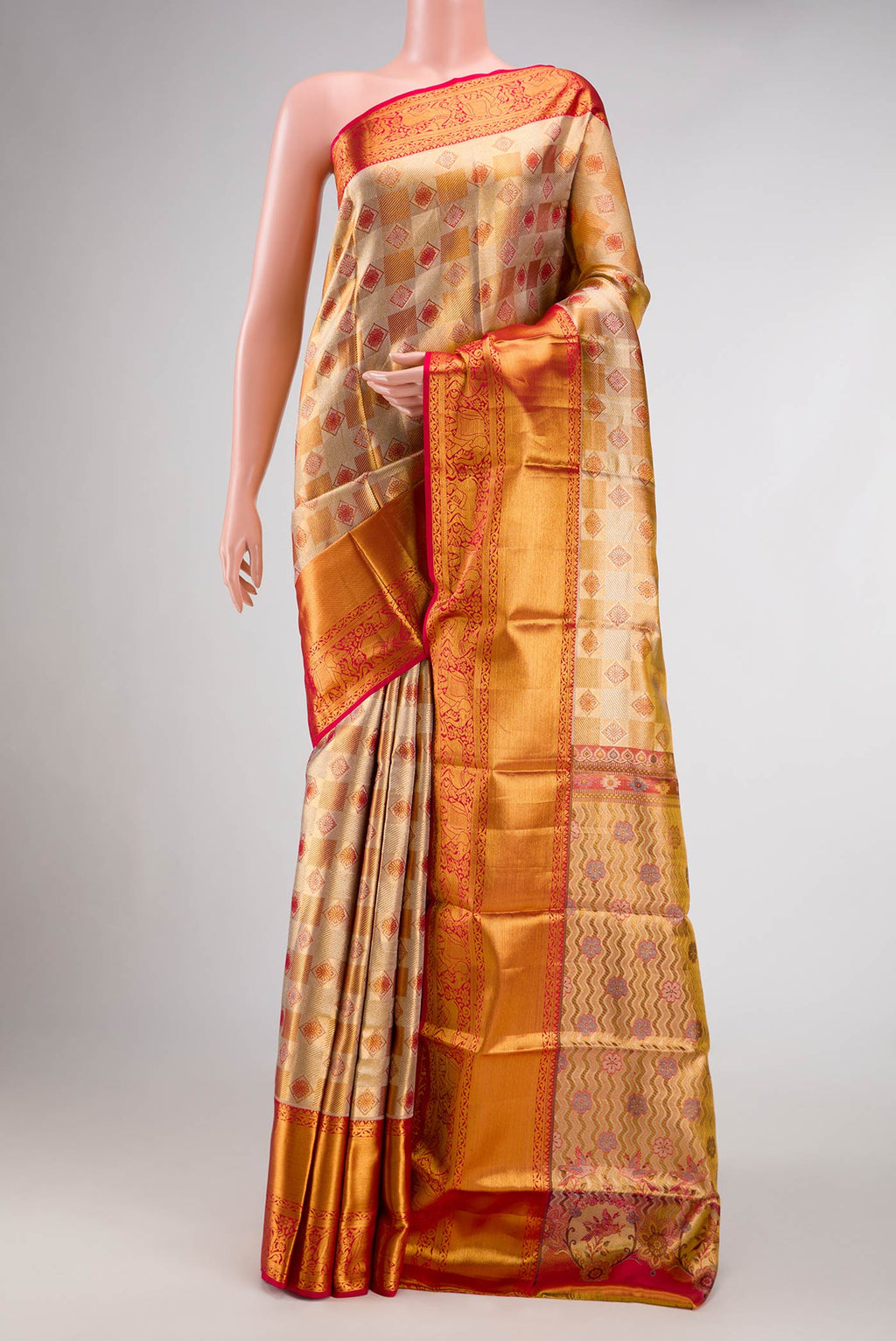Gold Dual Tone Kanchipuram Tissue Silk Saree with Zari Brocade on the body and Zari Border.  displayed on a mannequin
