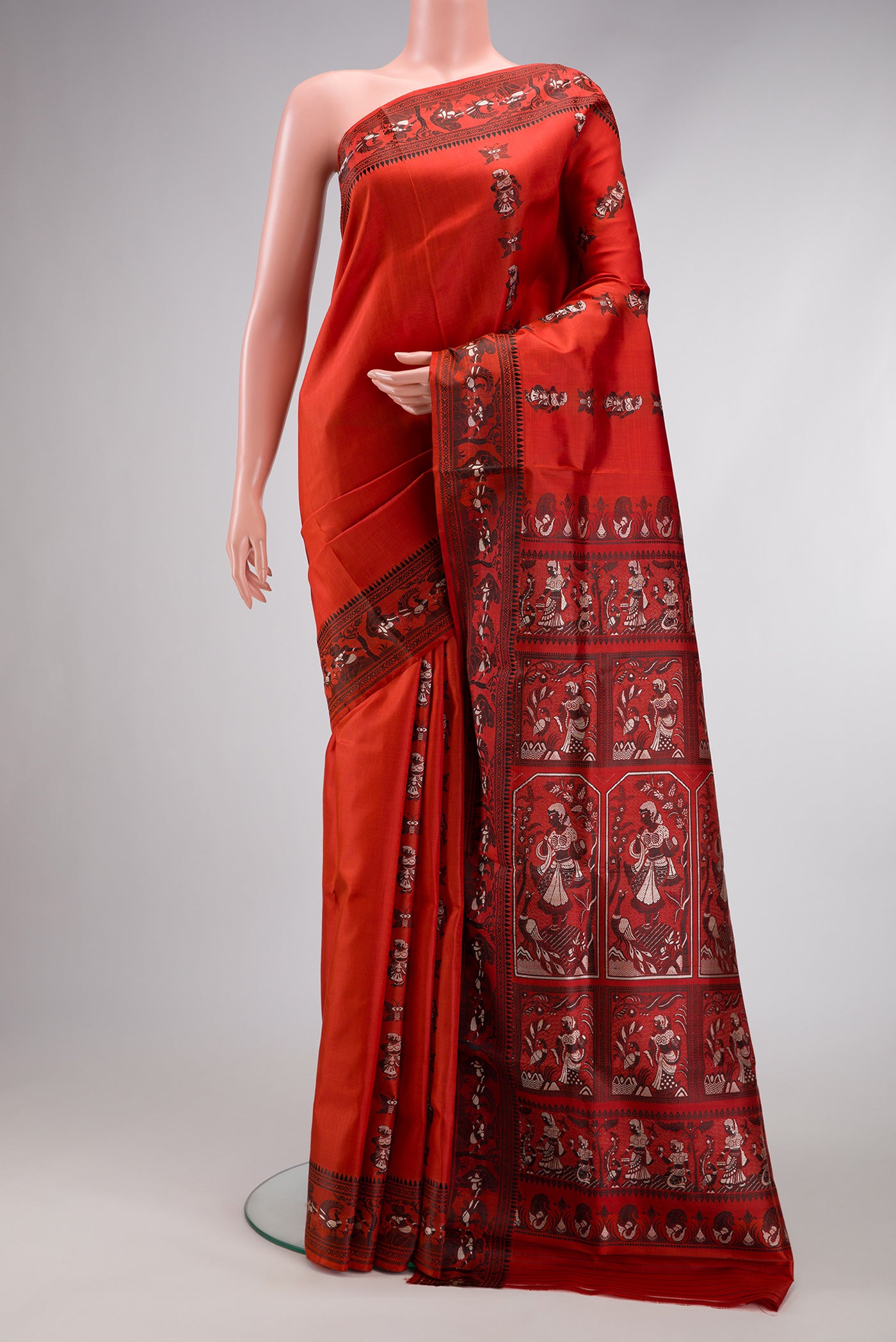 Rust Dual Tone Baluchari Silk Saree with Thread Butta on the body and Thread Border.  displayed on a mannequin