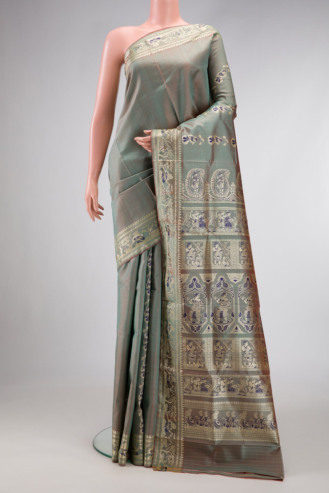 Light Blue Dual Tone Baluchari Silk Saree with Thread Butta on the body and Thread Border.  displayed on a mannequin