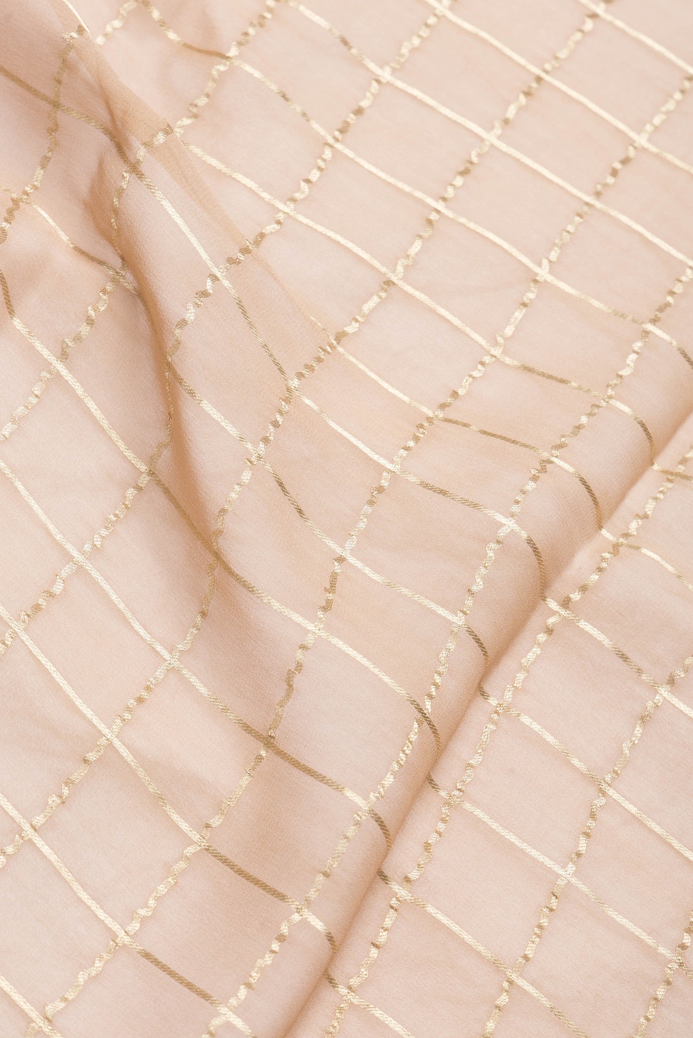 Close up of Brown Dual Tone Mysore Georgette Saree with Checked design on the body and Zari Border.  displaying folds
