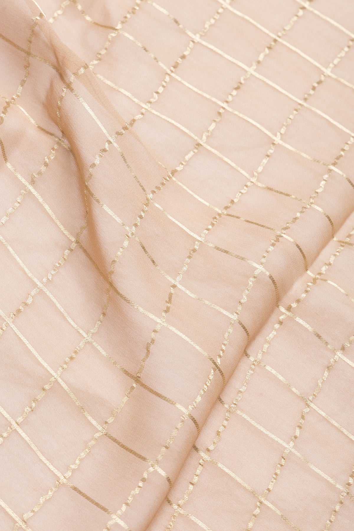 Close up of Brown Dual Tone Mysore Georgette Saree with Checked design on the body and Zari Border.  displaying folds
