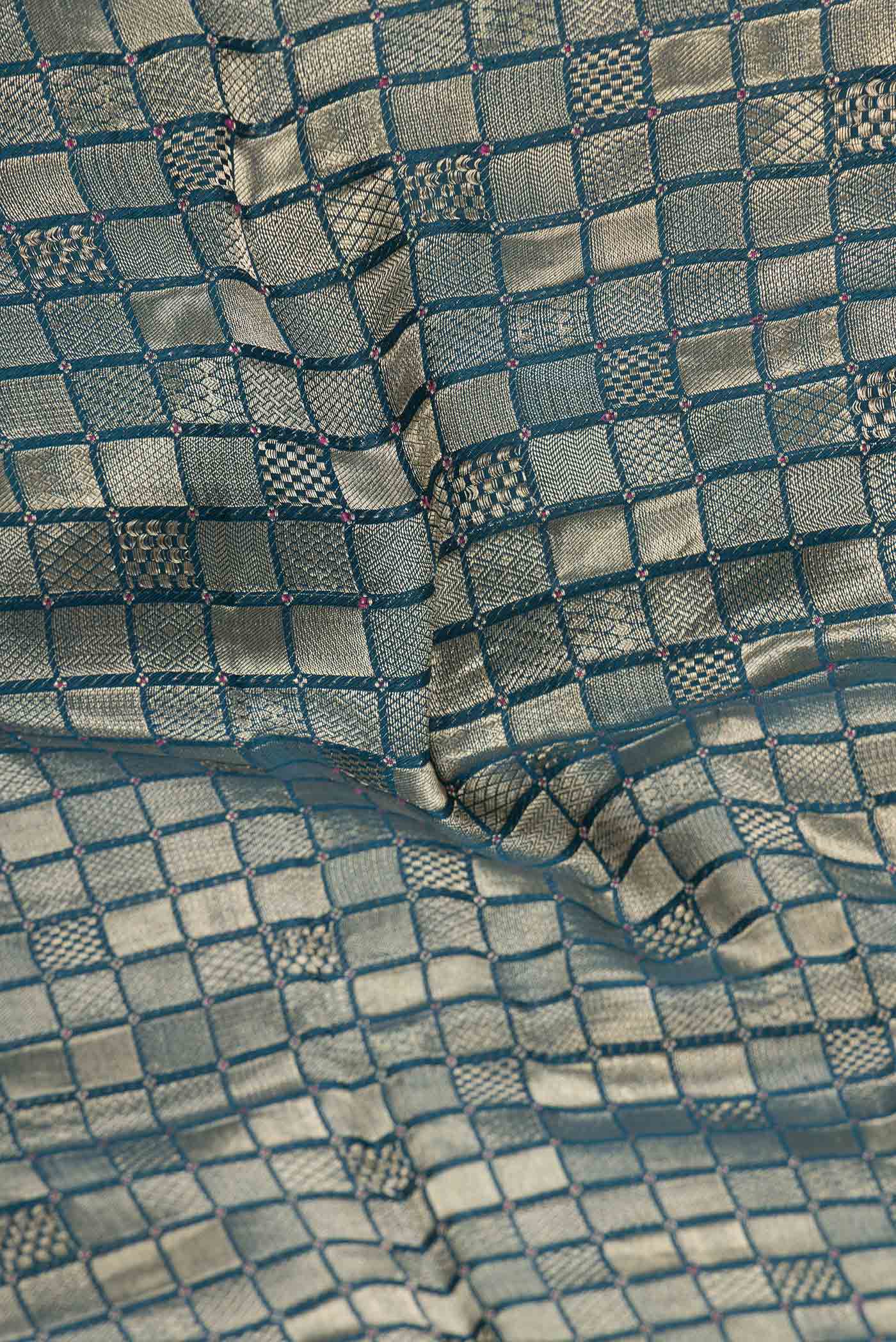 Close up of Sky Blue Dual Tone Mysore Georgette Saree with Zari Brocade on the body and Zari Border displaying folds