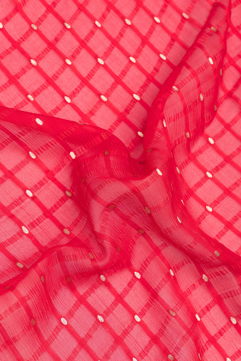 Close up of Red Mysore Chiffon Saree with Checked design on the body and Zari Border.  displaying folds
