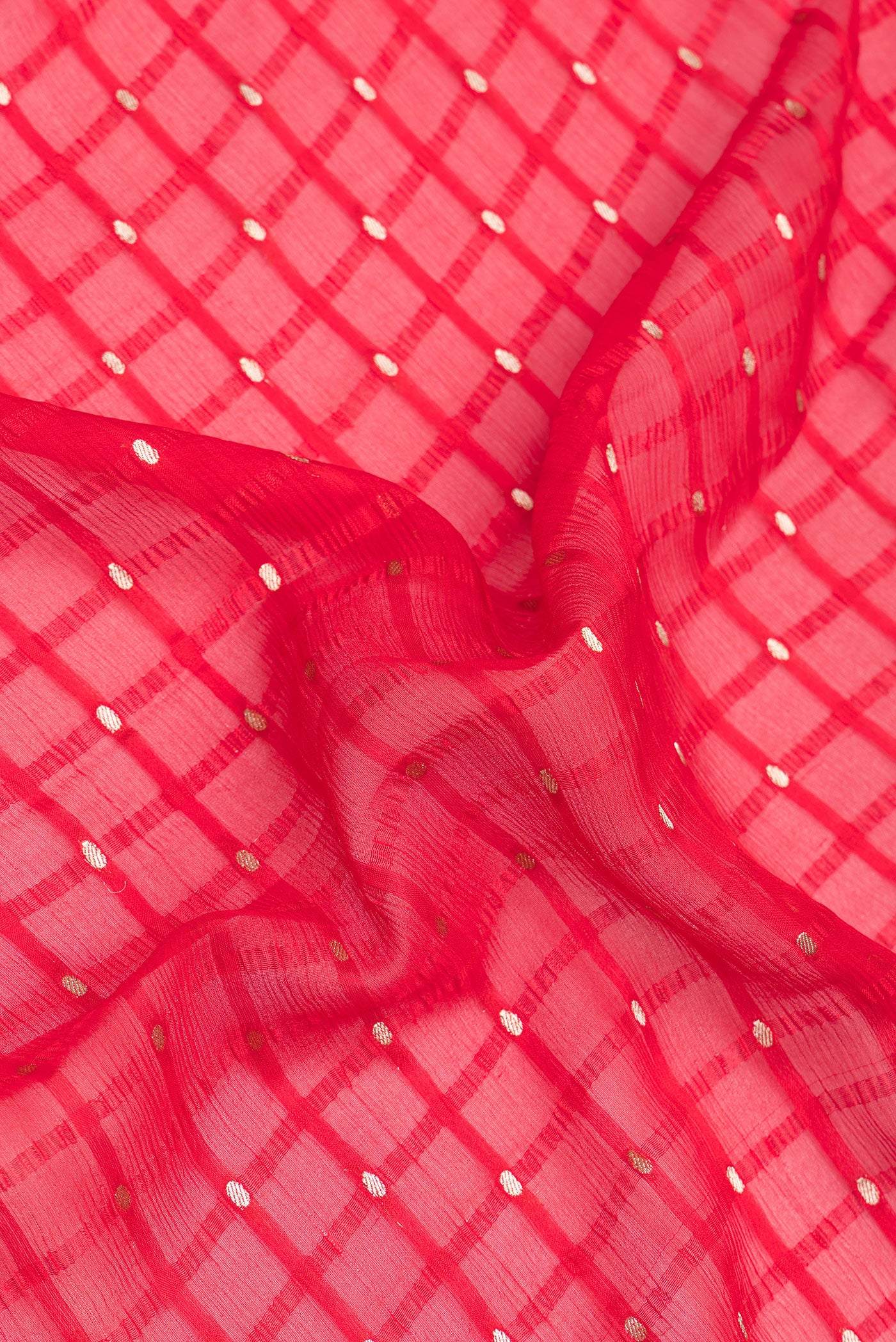 Close up of Red Mysore Chiffon Saree with Checked design on the body and Zari Border.  displaying folds