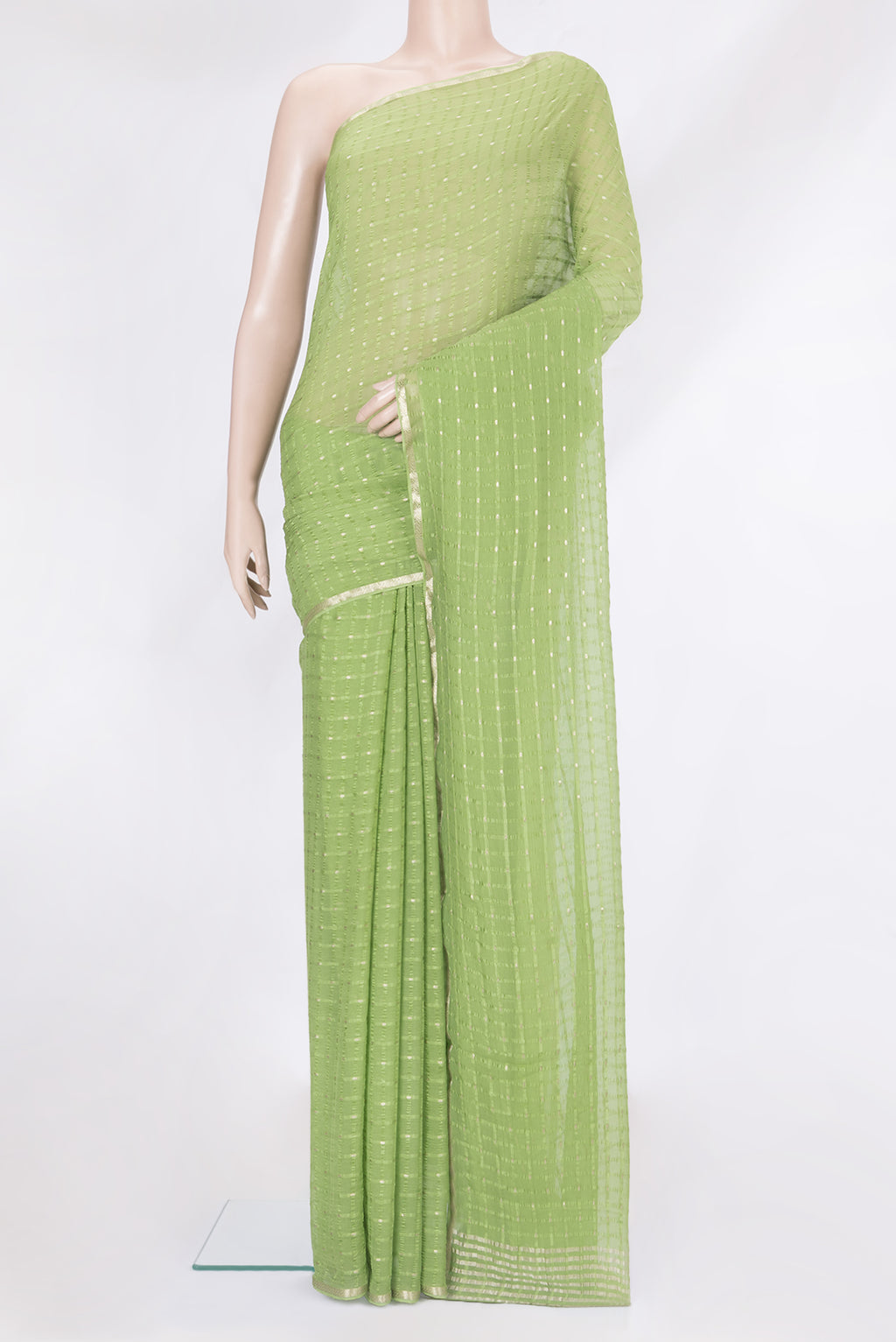 Light Green Mysore Chiffon Saree with Checked design on the body and Zari Border.  displayed on a mannequin