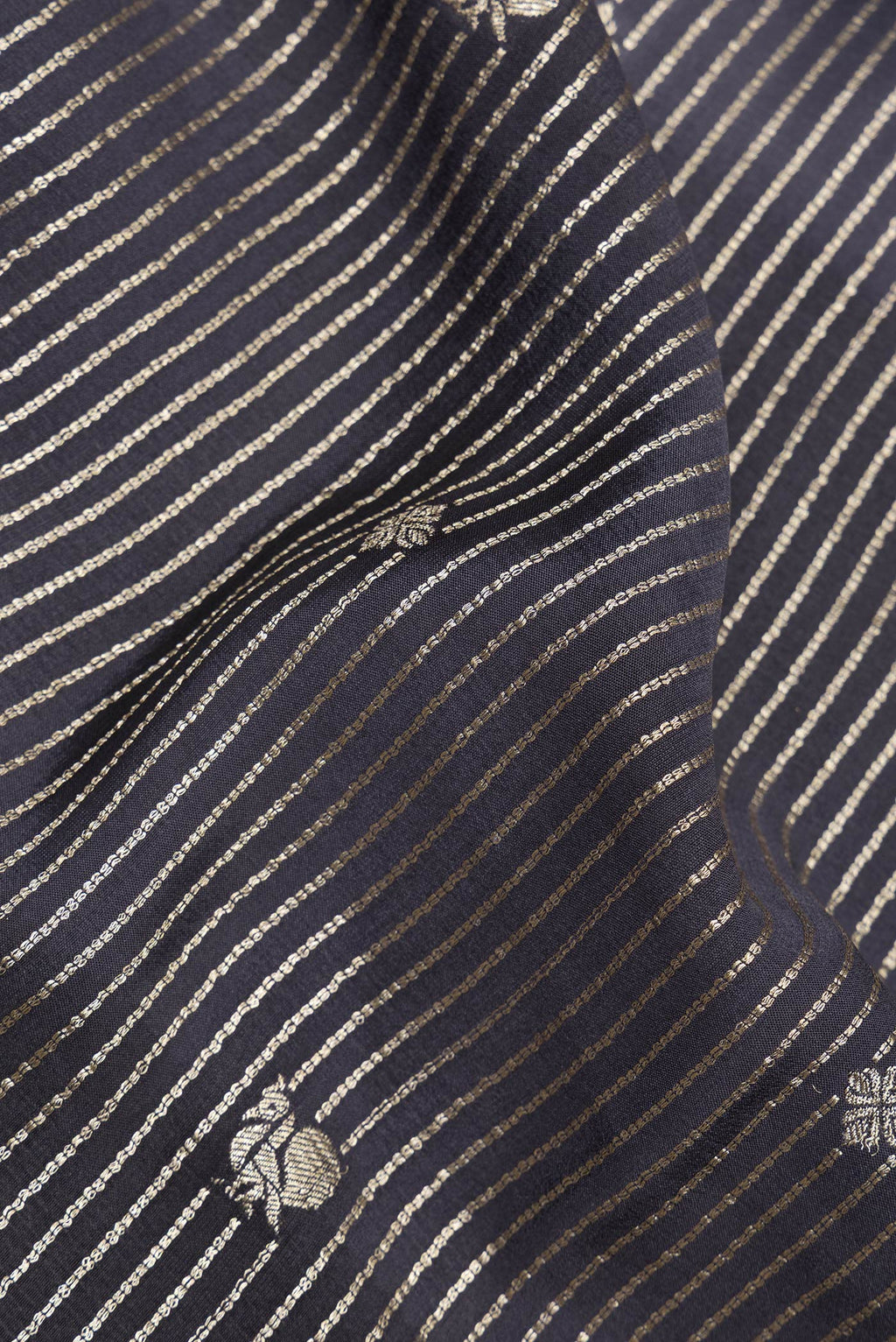 Close up of Pure Silk Black and Grey Color Mysore Silk Saree with Stripes on the body and Zari Border.  displaying folds
