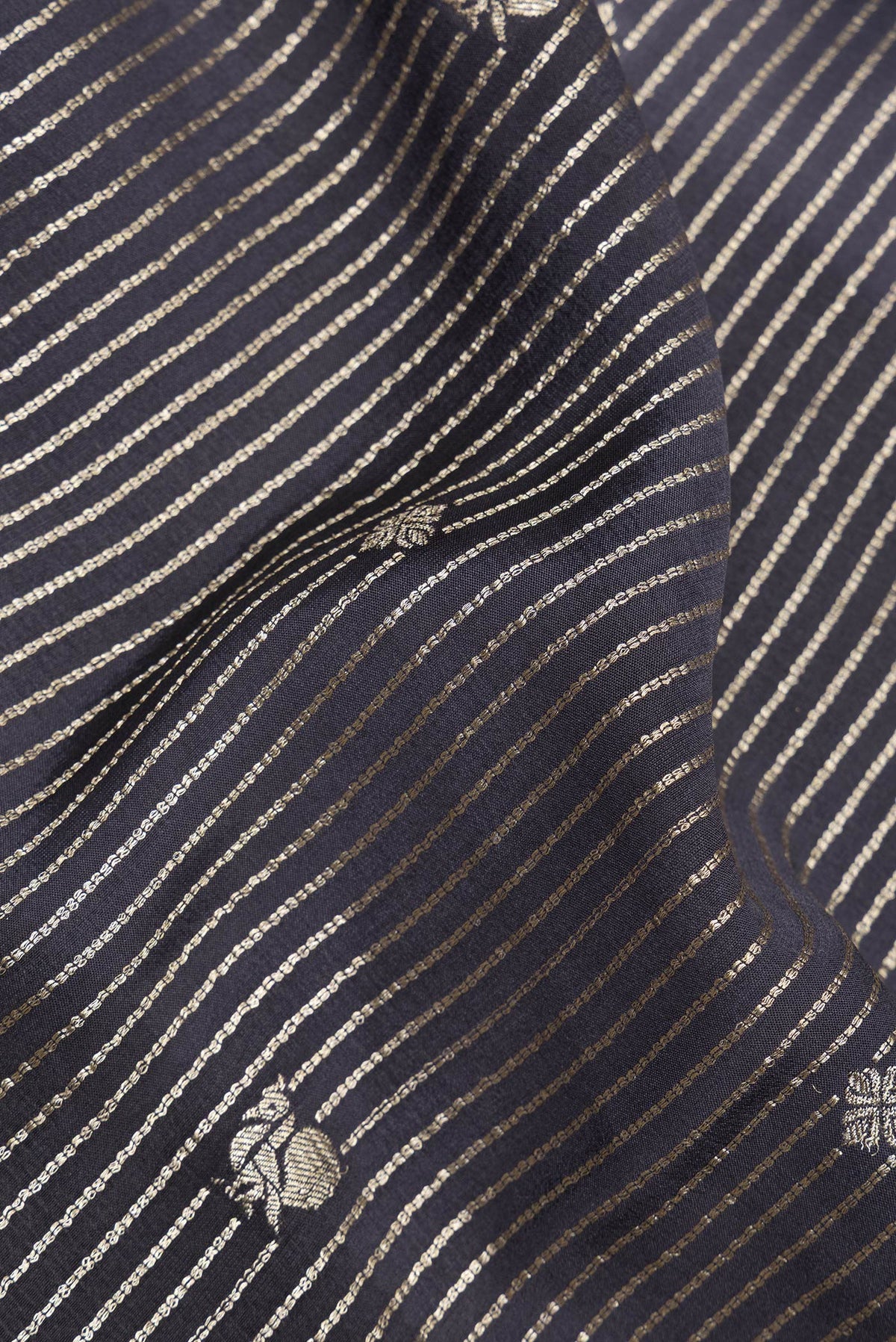 Close up of Pure Silk Black and Grey Color Mysore Silk Saree with Stripes on the body and Zari Border.  displaying folds