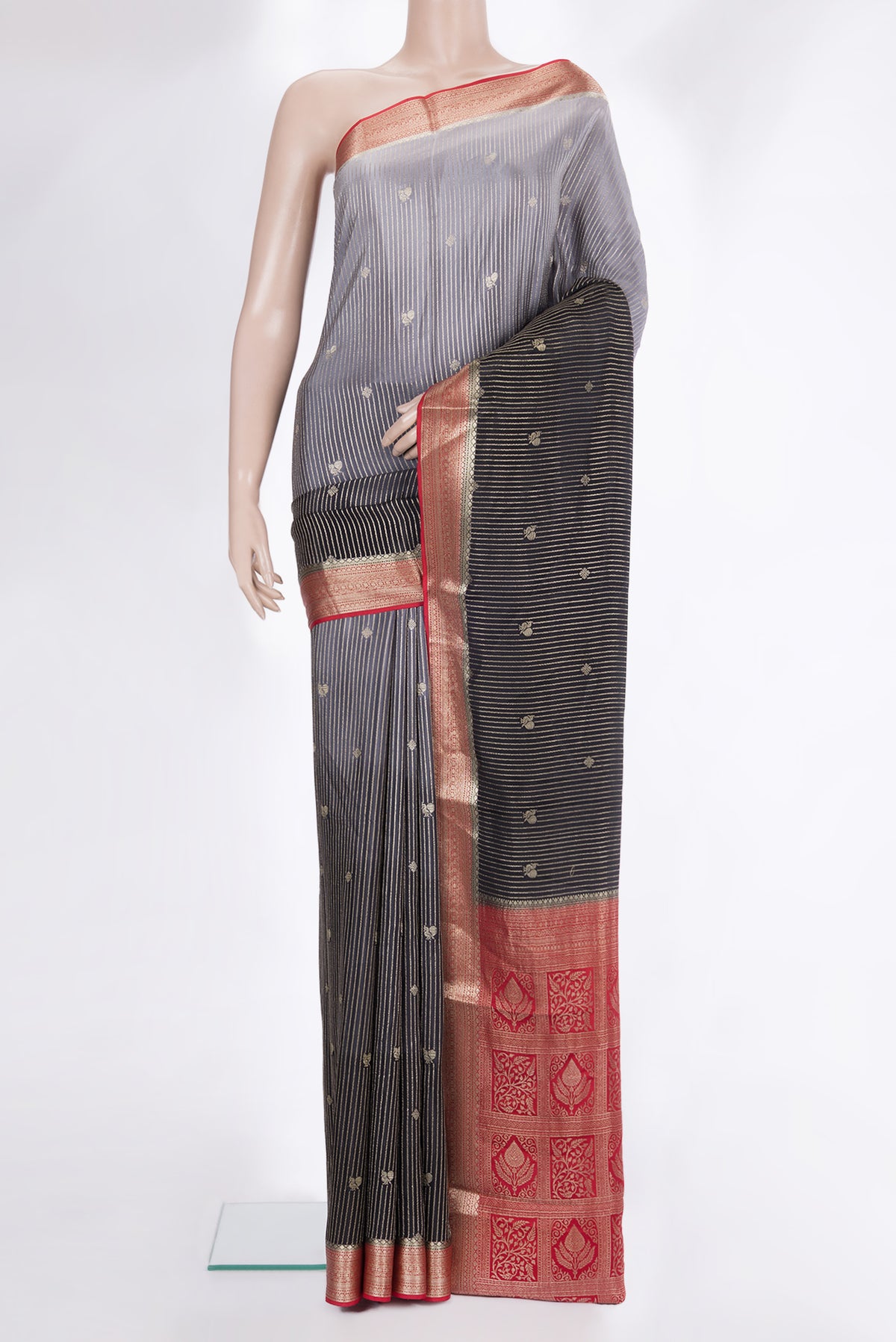 Pure Silk Black and Grey Color Mysore Silk Saree with Stripes on the body and Zari Border.  displayed on a mannequin