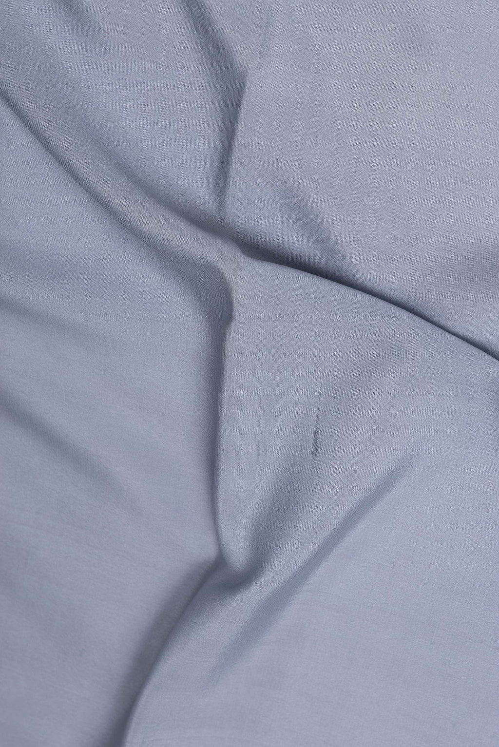 Close up of Grey Mysore Crepe Saree with Plain Body and Zari Border.  displaying folds