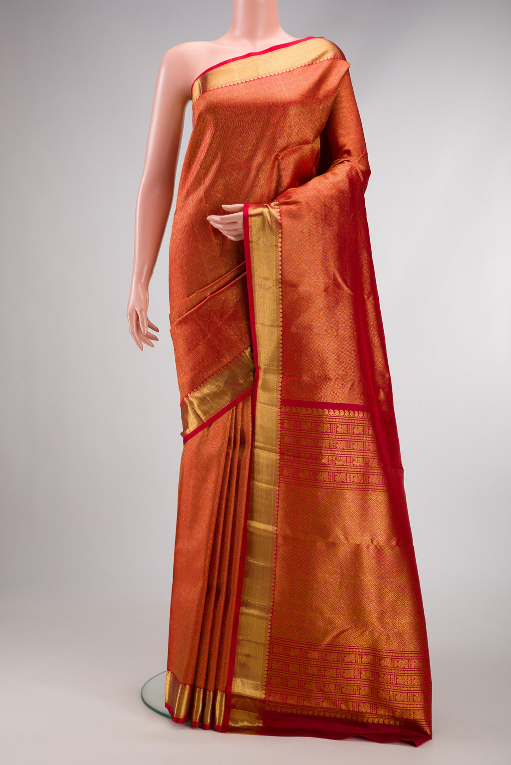 Maroon Dual Tone Kanchipuram Silk Saree with Zari Brocade on the body and Zari Border.  displayed on a mannequin
