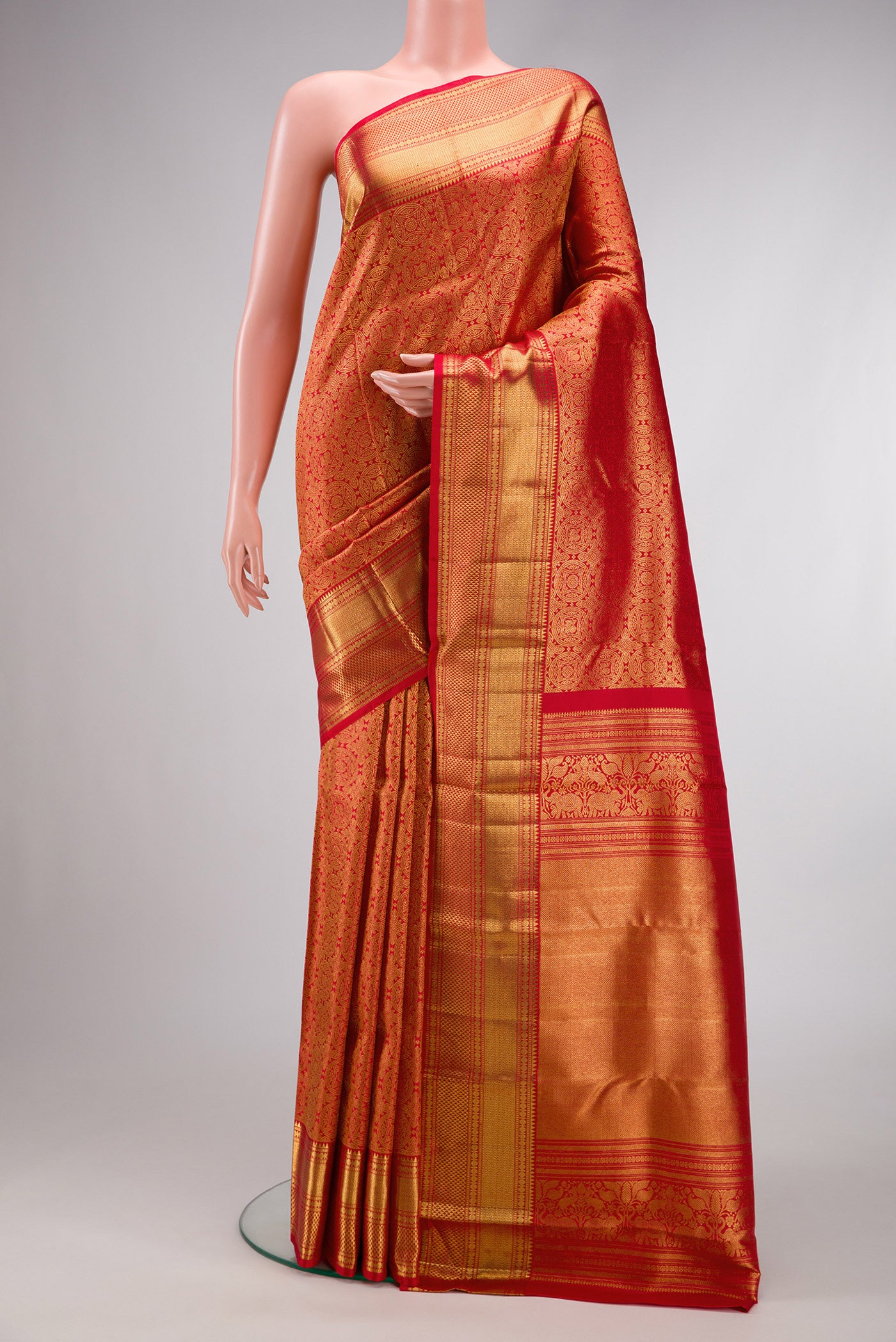 Red Dual Tone Kanchipuram Silk Saree with Zari Brocade on the body and Zari Border.  displayed on a mannequin