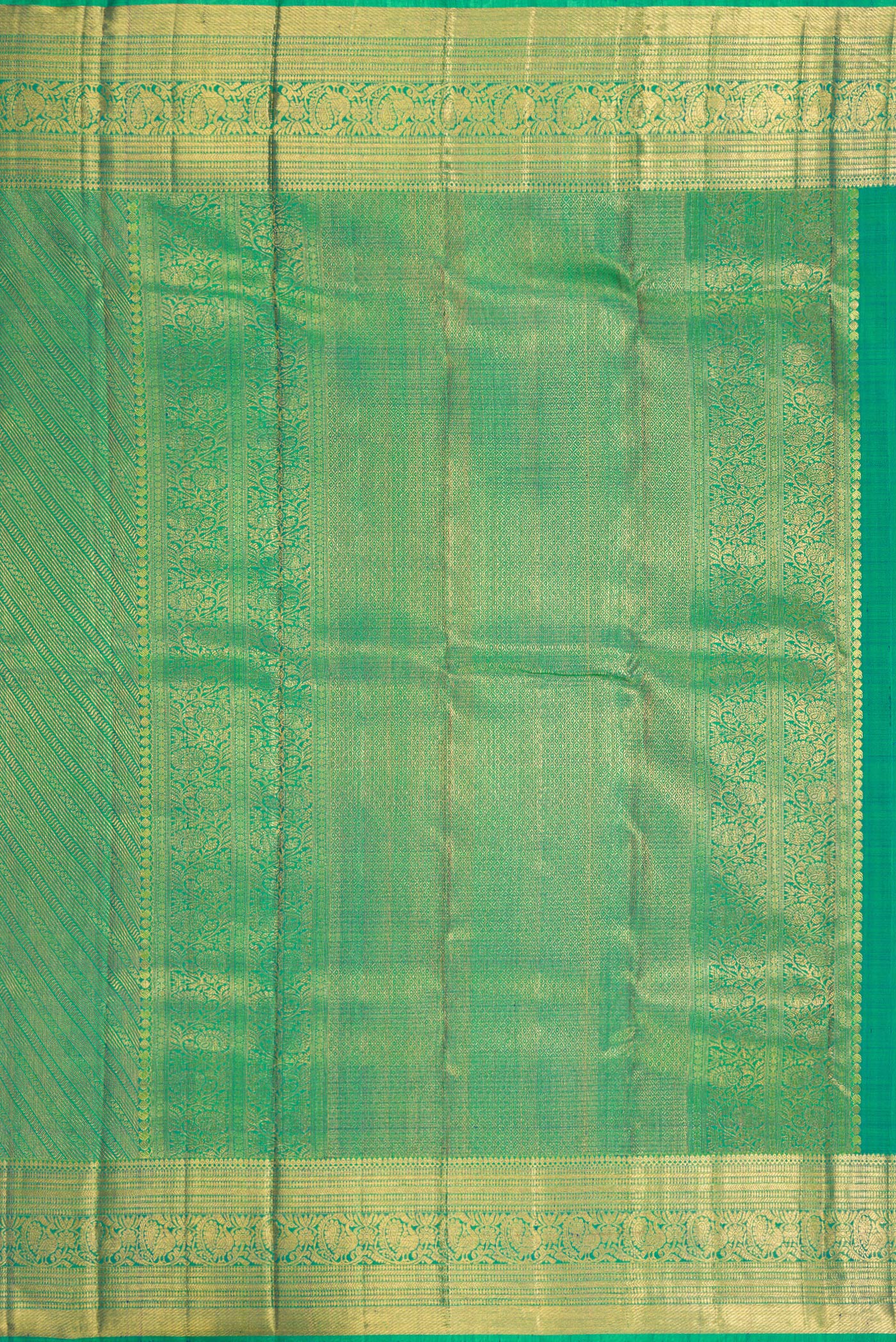 Close up image of the pallu of Green Dual Tone Kanchipuram Silk Saree with Zari Brocade on the body and Zari Border. 