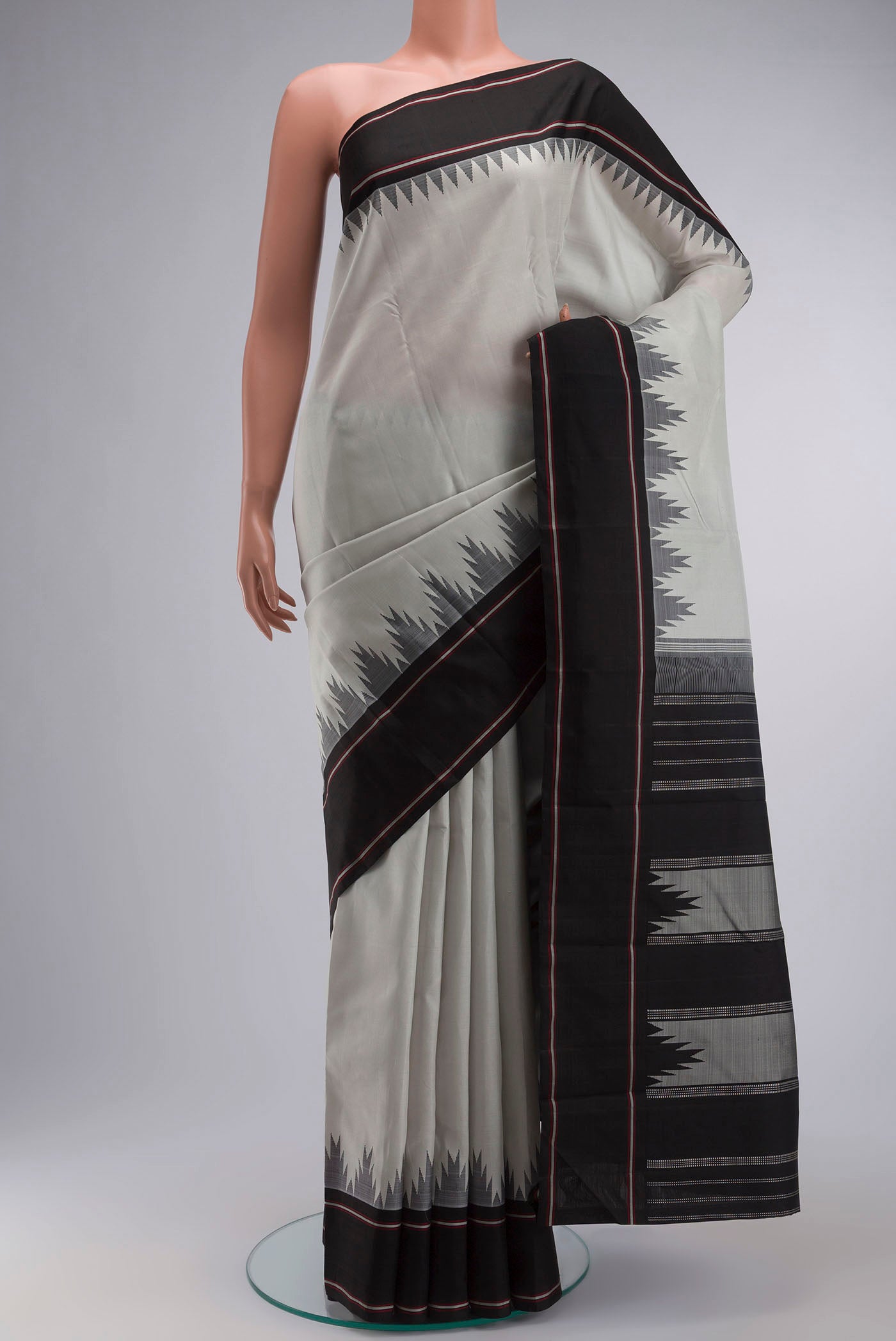Grey Kanchipuram Silk Saree with Plain Body and Temple Border displayed on a mannequin