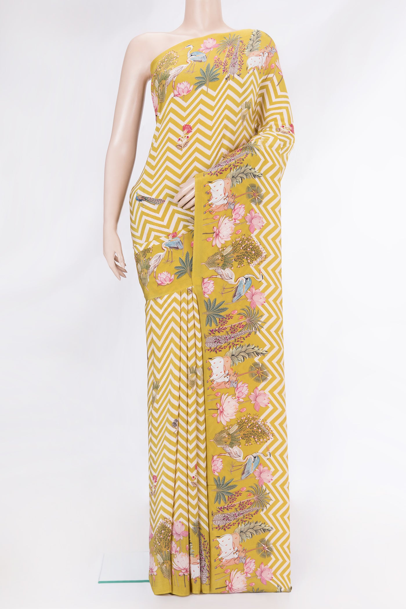 Mehandi Green Dual Tone Mysore Crepe Saree with Printed design on the body and Fancy Border.  displayed on a mannequin