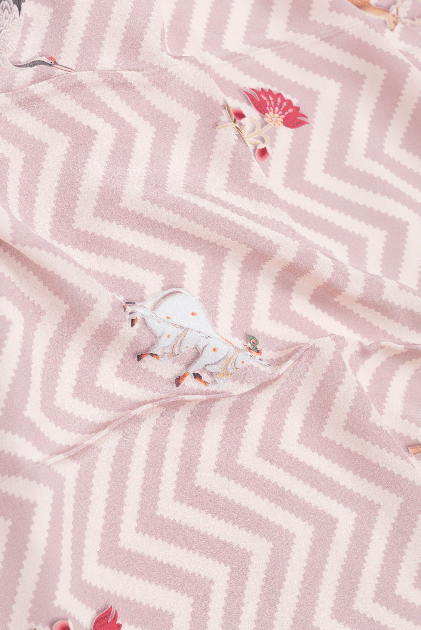 Close up of Pink Dual Tone Mysore Crepe Saree with Printed design on the body and Printed Border.  displaying folds
