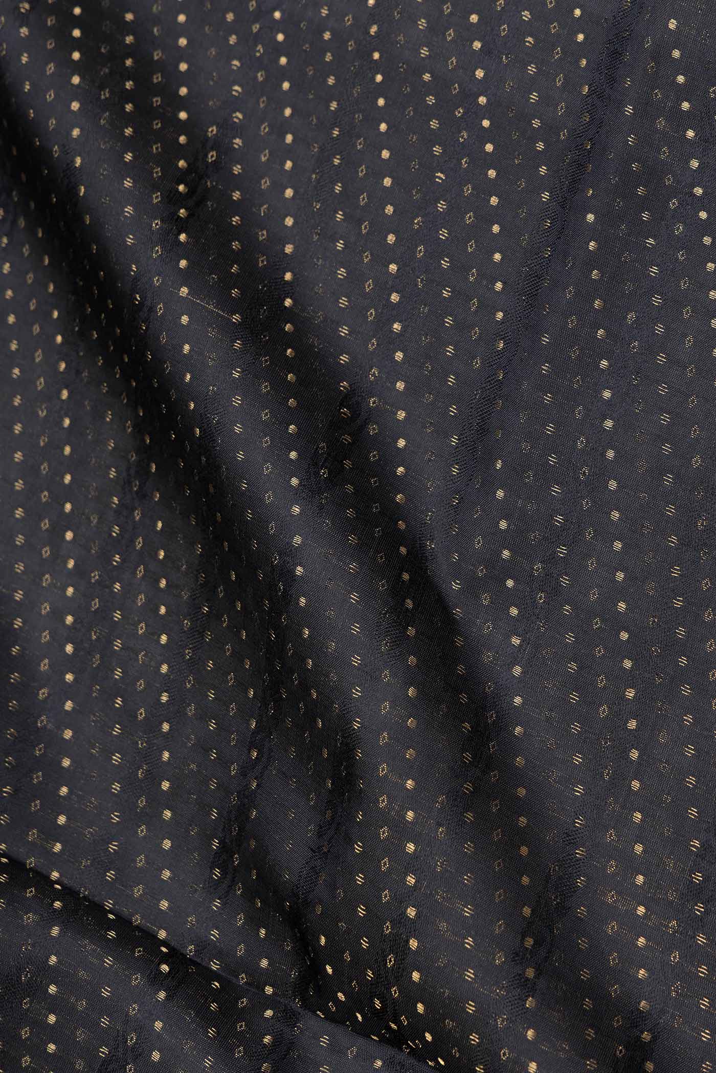 Close up of Black Dual Tone Soft Silk Saree with Zari Brocade on the body and Zari Border.  displaying folds