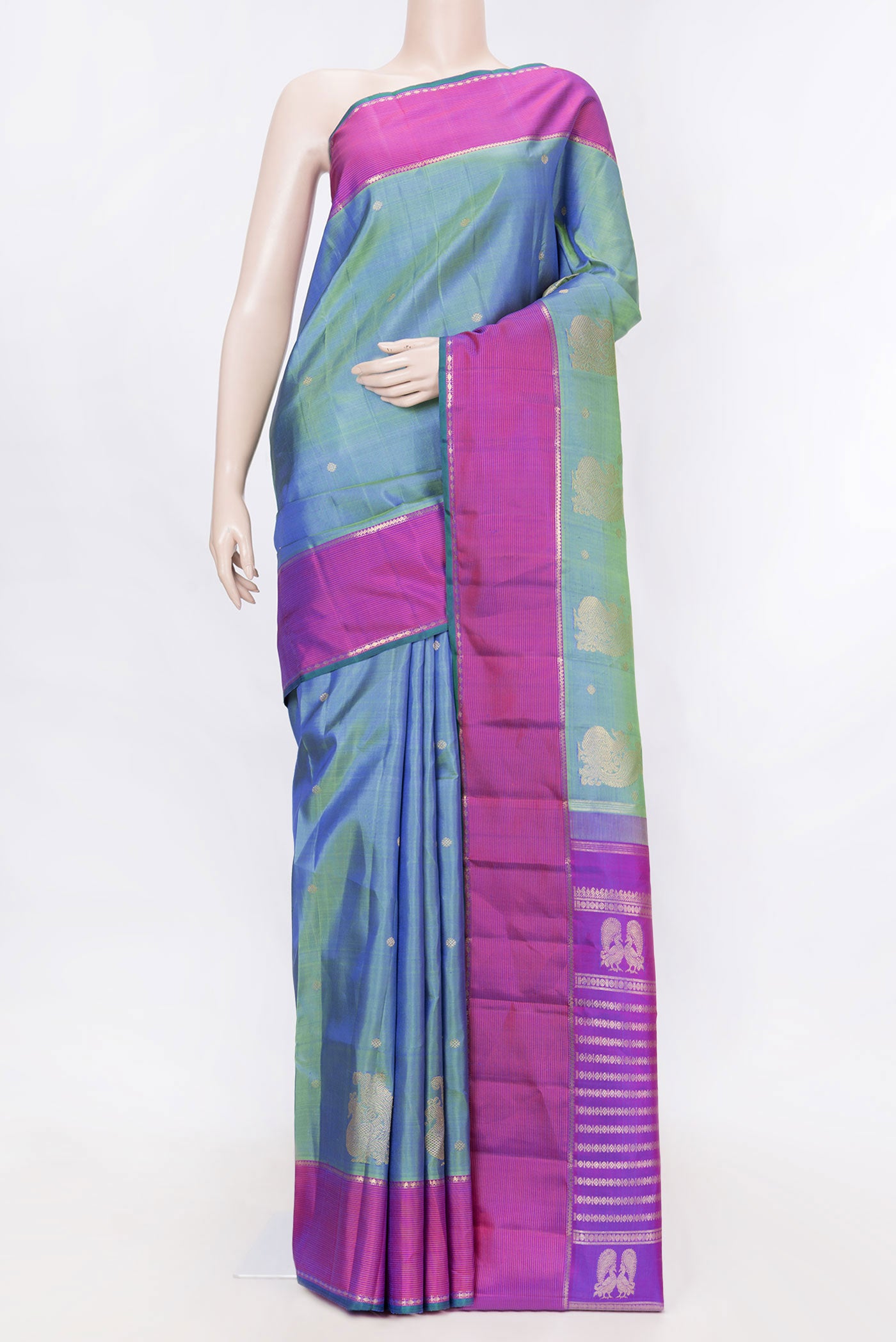 Green Dual Tone Kanchipuram Silk Saree with Zari Butta on the body and Zari Border displayed on a mannequin