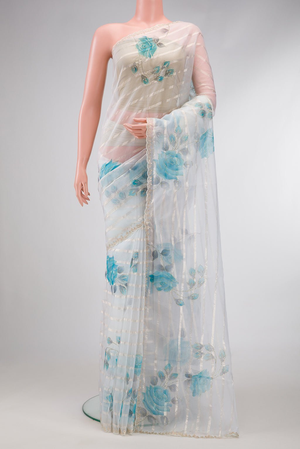 Off White Dual Tone Organza Silk Saree with Stripes on the body and Embroidery Border.  displayed on a mannequin