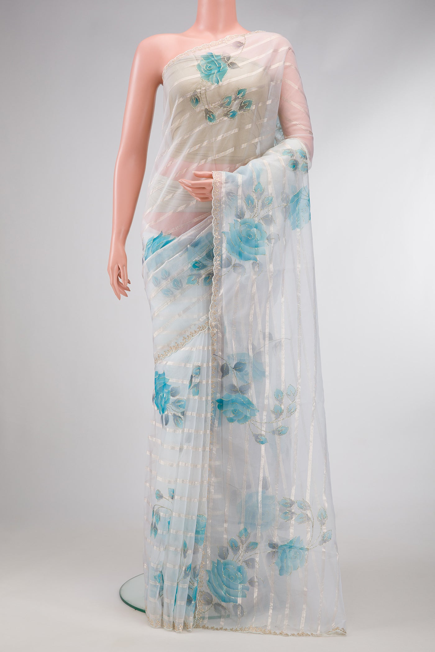 Off White Dual Tone Organza Silk Saree with Stripes on the body and Embroidery Border.  displayed on a mannequin