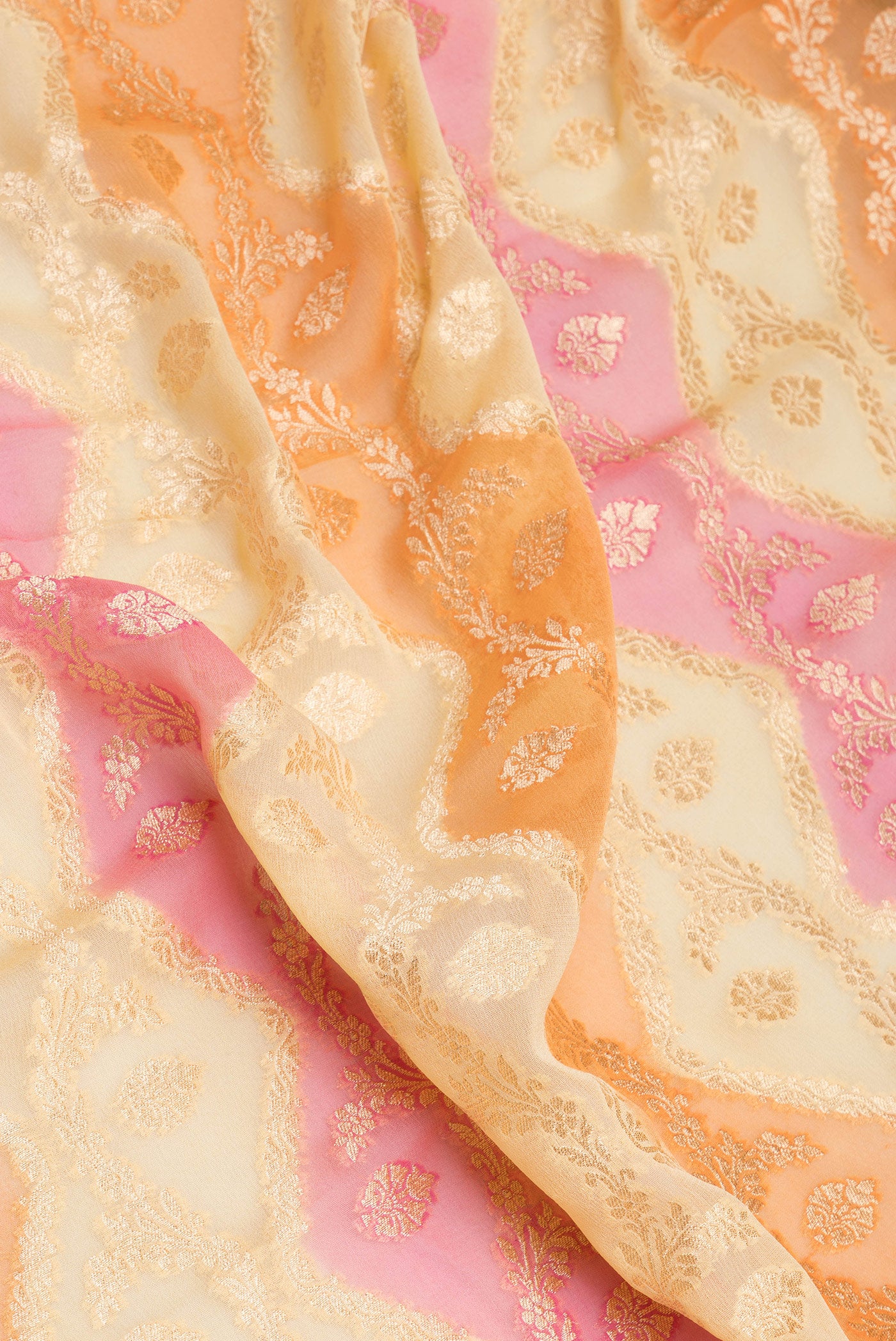 Close up of Multi Color Banarasi Georgette Saree with Zari Brocade on the body and Zari Border.  displaying folds